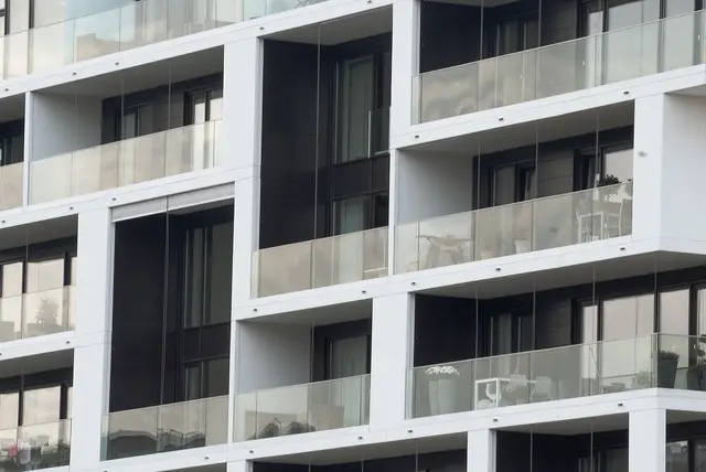 A close-up view of multiple balconies in a contemporary apartment building